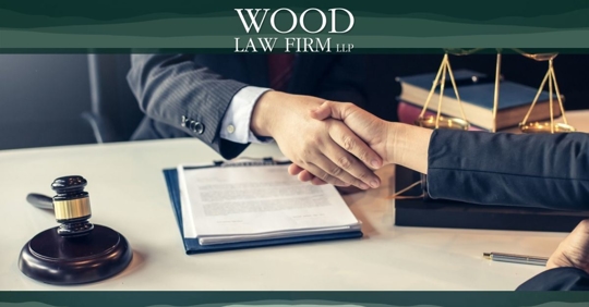 Attorney shaking hands with client